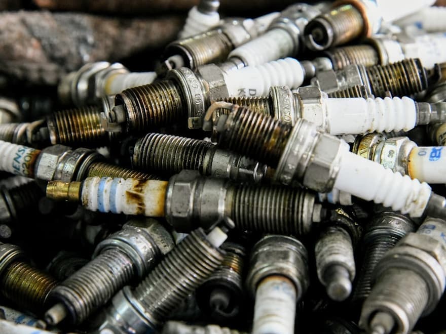 Set of used spark plugs removed from an engine